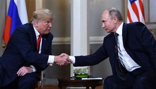 Russian President Vladimir Putin and US President Donald Trump shake hands in Helsinki on Monday.