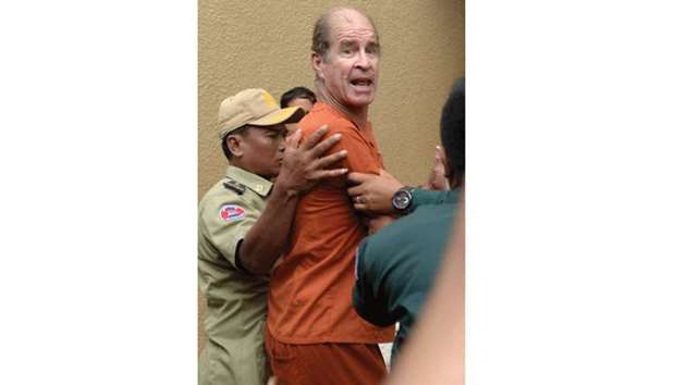 James Ricketson arrives in Phnom Penh court for his continuing trial yesterday.