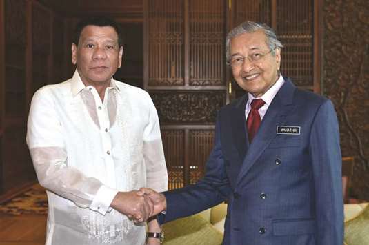 President Rodrigo Duterte meets with Malaysiau2019s Prime Minister Mahathir Mohamed in Putrajaya, yesterday.