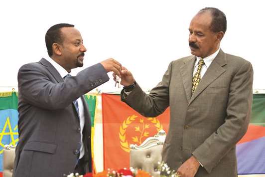 Ethiopian Prime Minister Abiy Ahmed and President Isaias Afwerki of Eritrea (right) celebrate the opening of the Embassy of Eritrea in Ethiopia.