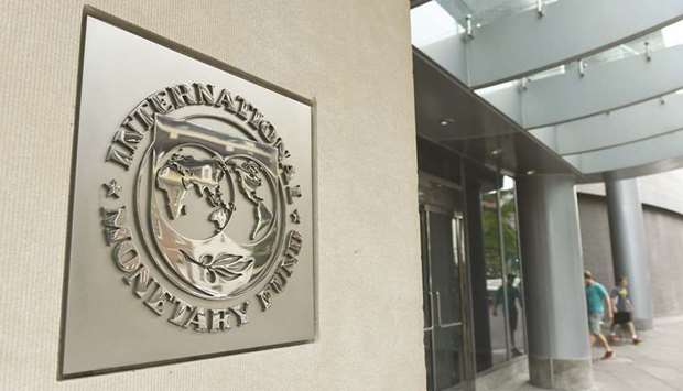 The International Monetary Fund headquarters in Washington, DC. The global economy is still expected to grow at a solid pace this year, but worsening trade confrontations pose serious risks to the outlook, the IMF said yesterday.
