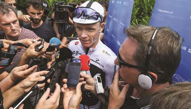 Great Britainu2019s Christopher Froome addresses the media outside his teamu2019s hotel in Chambery yesterday. (AFP)