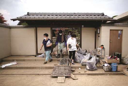The damaged house of 51-year-old Kairyu Takahashi, an Okayama prefectural assemblyman, is seen in a flood affected area in Mabi town in Kurashiki, Japan.