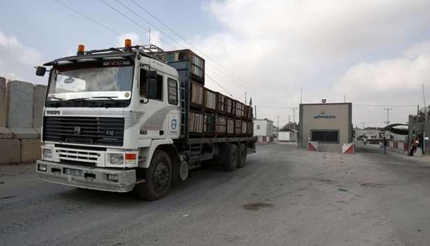 A truck is seen at the gate of the Kerem Shalom crossing, the main passage point for goods entering Gaza, in the southern Gaza Strip town of Rafah