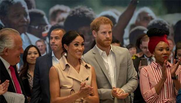 Britain's Prince Harry and Meghan, the Duchess of Sussex, visit the Nelson Mandela Centenary Exhibition at Southbank Centre's Queen Elizabeth Hall in London on Tuesday.