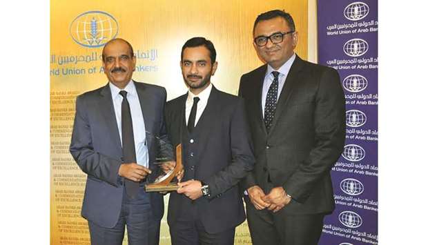 Doha Bank acting chief Human Resources officer Sheikh Mohamed bin Fahad al-Thani receiving the award from Wuab secretary-general Wissam Fattouhto.