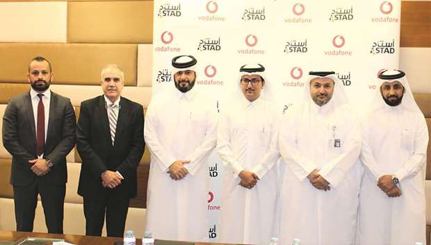 Dignitaries from Vodafone Qatar and Astad after the signing ceremony.
