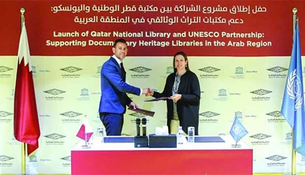QNL and Unesco officials at the signing of the agreement.