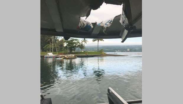 A Department of Land and Natural Resources handout photo shows the damaged roof of the boat Hot Spot after a projectile from the Kilauea volcano in Hawaii struck the vessel carrying people watching lava from the two- month-old eruption, injuring 23, the fire department said.