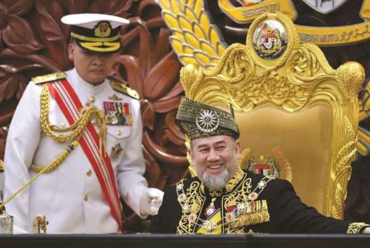Malaysian King Sultan Muhammad V prepares to deliver his address during the opening ceremony of the parliament in Kuala Lumpur yesterday.