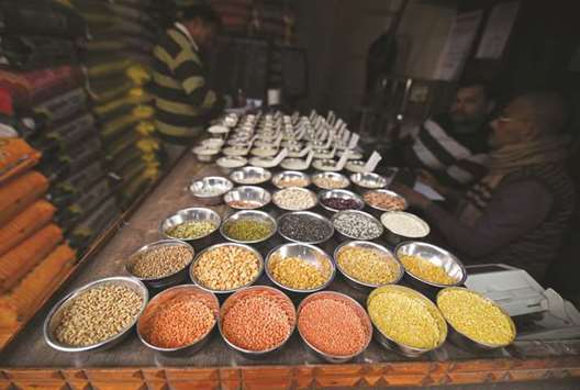 Pulses are kept on display for sale inside a shop at a wholesale market in Guwahati. Pulses imports to India, the worldu2019s biggest buyer, may fall to their lowest in nearly two decades after the government raised import taxes and restricted overseas purchases to bolster prices, impacting the plans of its global suppliers.