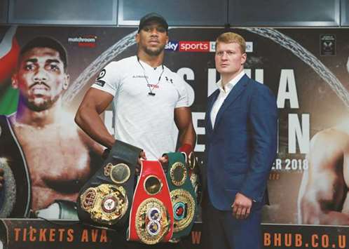 Anthony Joshua (left) and Alexander Povetkin pose after the press conference in London yesterday. (Reuters)