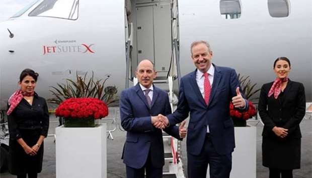 Qatar Airways Group chief executive Akbar al-Baker with JetSuite Inc founder and CEO Alex Wilcox.