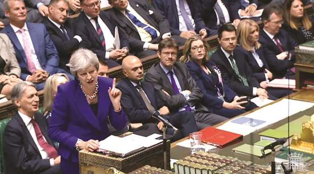 Theresa May speaks during Prime Ministeru2019s Questions (PMQs) in the House of Commons in London yesterday.