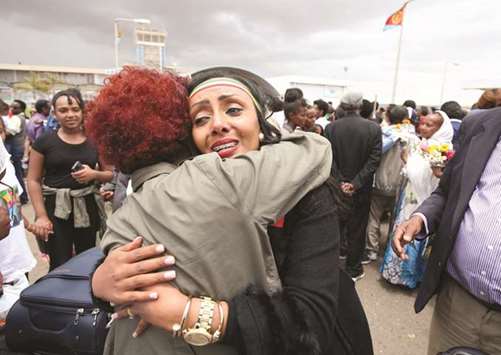 Relatives embrace after meeting at Asmara International Airport after one arrived aboard the Ethiopian Airlines flight from Addis Ababa.