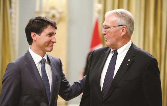 Canadau2019s Prime Minister Justin Trudeau congratulates Bill Blair after he was sworn-in as Minister of Border Security and Organized Crime Reduction during a cabinet shuffle at Rideau Hall in Ottawa yesterday.