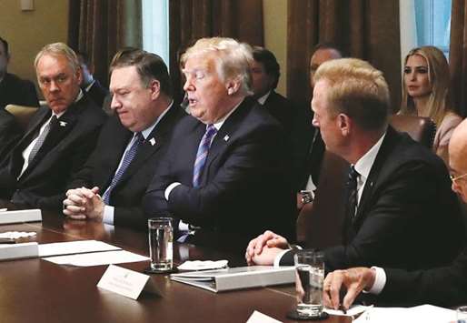 US President Donald Trump participates in a meeting in the Cabinet Room of the White House in Washington.