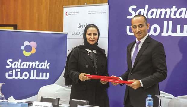 Nora Rashid al-Dosari and Sami Abi Nakhoul at the MoU-signing ceremony.