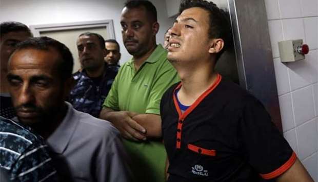 A relative of a Hamas member killed in an Israeli air strike reacts at a hospital in Gaza Strip on Thursday.