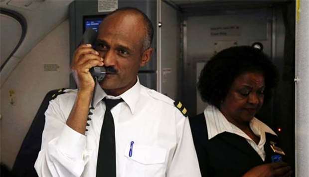 A cabin crew supervisor makes an announcement aboard an Ethiopian Airlines flight to Asmara on Wednesday.