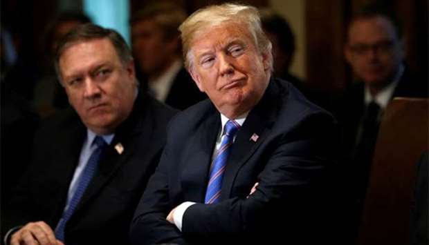 President Donald Trump and Secretary of State Mike Pompeo listen during a cabinet meeting at the White House in Washington on Wednesday.