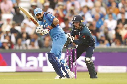 Indiau2019s Virat Kohli (left) in action during the ODI against England at Headingley in Leeds, England, on Tuesday. (Reuters)