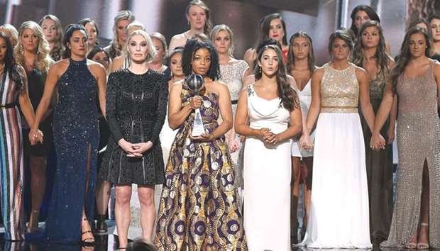 (Foreground, from left) Sarah Klein, Tiffany Thomas Lopez, Aly Raisman and recipients of the Arthur Ashe Award for Courage speak onstage at The 2018 ESPYS at Microsoft Theatre in Los Angeles, California, on Wednesday. (AFP)