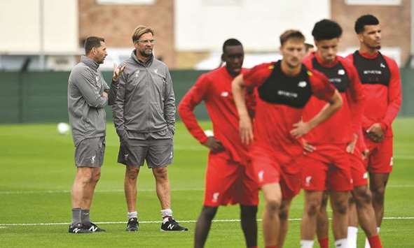 Liverpool manager Jurgen Klopp (second left) has admitted it is unlikely he will have a full squad to choose from for the opening game of the new season.