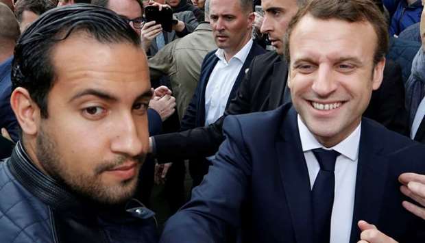 Emmanuel Macron (R) flanked by Alexandre Benalla (L) attends a campaign visit in Rodez, France on May 5, 2017, when he was a  candidate for the 2017 presidential election.