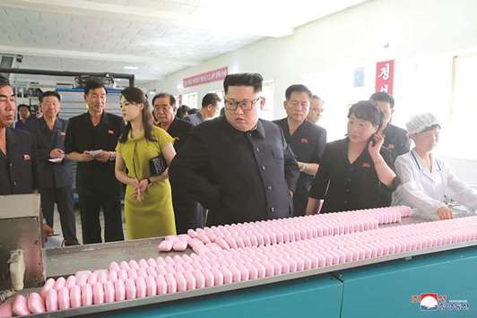 North Korean leader Kim Jong-un and his wife Ri Sol-ju visit the Sinuiju Cosmetics Factory in Sinuiju, North Korea.