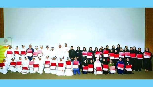 The participants with Qatar Foundation officials.