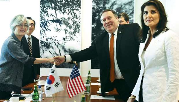 US Secretary of State Mike Pompeo, with US ambassador to the UN Nikki Haley and South Korean ambassador to the UN Cho Tae-yul, shakes hand with South Korean Foreign Minister Kang Kyung-wha before a meeting yesterday, in New York.