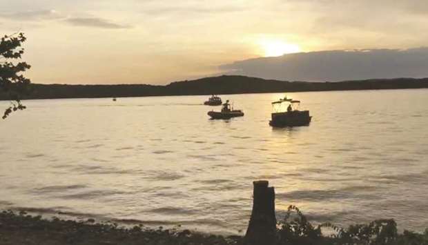 This video grab taken from handout footage released by the Southern Stone County Fire Protection District shows crews working at the scene where a tourist boat capsized and sank during a storm on a lake near Branson, Missouri.