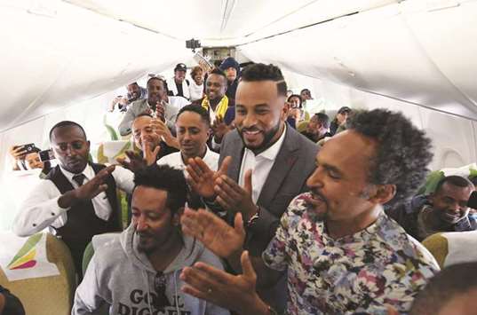 This picture taken on Wednesday shows passengers rejoicing inside a Ethiopian Airlines flight upon landing in Asmara international airport.
