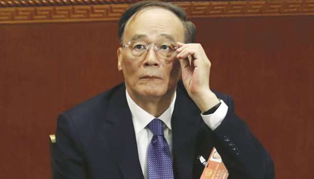 Wang Qishan, Chinau2019s former anti-corruption czar and and an official regarded as Chinese President Xi Jinpingu2019s right-hand man attends the opening session of the annual National Peopleu2019s Congress in Beijingu2019s Great Hall of the People in this  March 5, file photo.