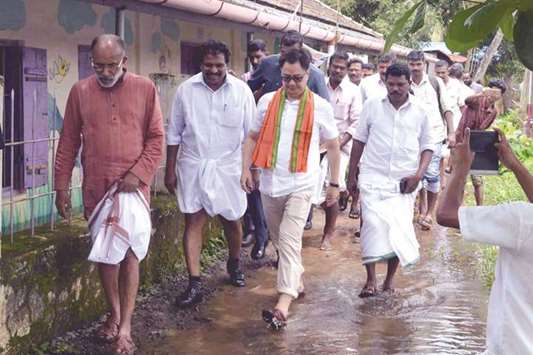 Minister of State for Home Kiren Rijiju and Minister of State for Tourism K J Alphons visit a flood relief camp at Aryad in Alappuzha district of Kerala yesterday.