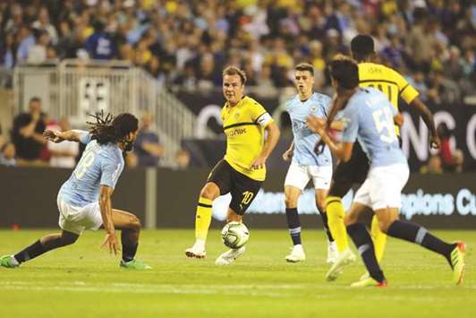 Mario Gotze (second left) of Borussia Dortmund in action against Manchester City during an International Champions Cup match at Soldier Field in Chicago, Illinois, on Friday night. (AFP)