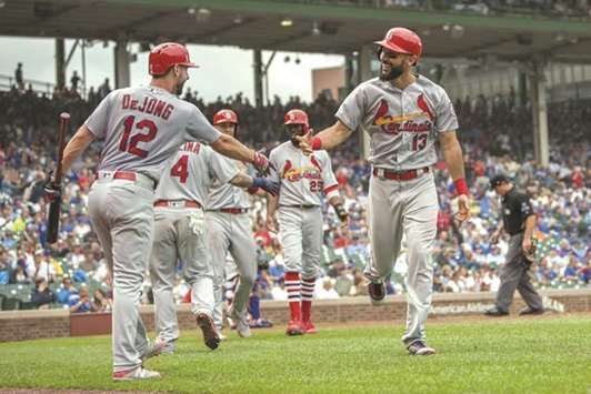 St. Louis Cardinals first baseman Matt Carpenter (right) celebrates his three run home run during the sixth inning against the Chicago Cubs at Wrigley Field. PICTURE: USA TODAY Sports