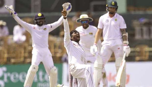 Sri Lankan spinner Akila Dananjaya (centre) celebrates after dismissing South Africau2019s Dale Steyn during second Test at the Sinhalese Sports Club in Colombo yesterday. (AFP)