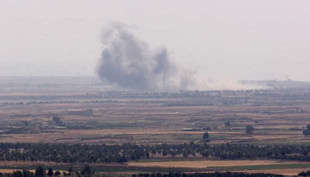 Smoke rises from al Yarmouk valley in Quneitra, Syria