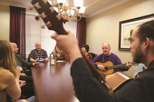 THERAPY: Patients enjoying recalling the guitar tunes, they had once known, during a small session with professional musicians at a 12-week music therapy programme for those with dementia and Alzheimers.