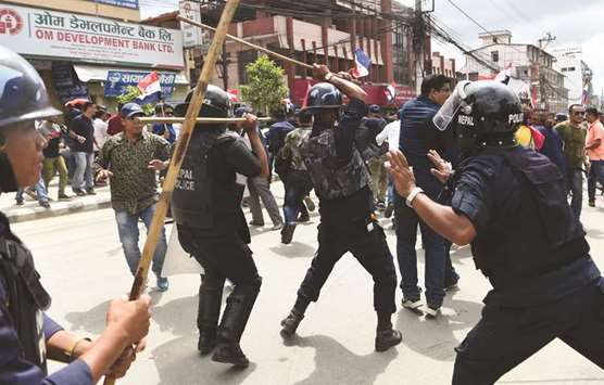 Policemen and activists of the Tarun Dal, the youth wing of Nepali Congress Party, clash during a demonstration against the government in Kathmandu.