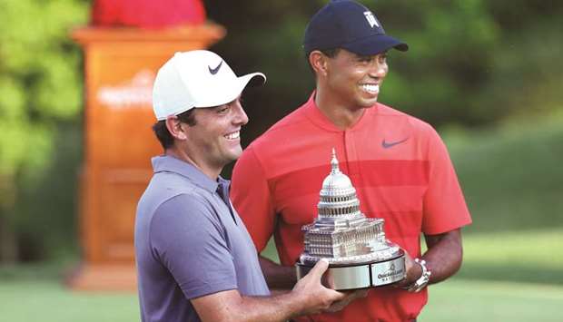 Francesco Molinari of Italy celebrates with the trophy and Tiger Woods after winning the Quicken Loans National during the final round at TPC Potomac in Potomac, Maryland. (Getty Images/AFP)