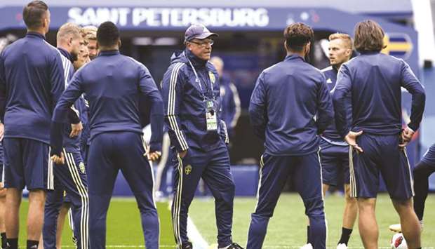 Swedenu2019s coach Janne Andersson (centre) addresses his players during a training session in Saint Petersburg yesterday. (AFP)