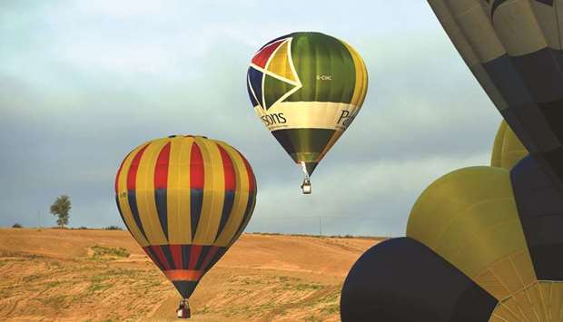 Hot air balloons fly during the Sagrantino International Balloon Challenge Cup near Todi in Umbria region of Italy.