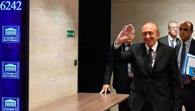 France's interior minister Gerard Collomb gestures as he arrives to appear before the Law Commission of the lower house of parliament, in Paris on Monday.