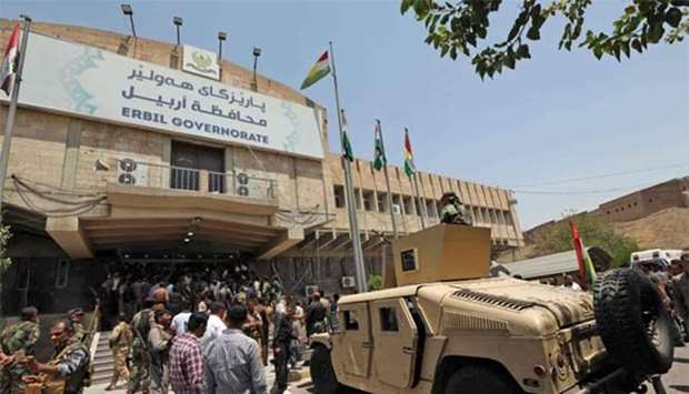 Kurdish security forces gather at the Erbil governorate headquarters after an attack in Erbil, the capital of autonomous Iraqi Kurdistan, on Monday.