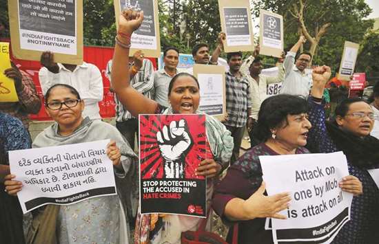 People shout anti-government slogans during a protest against what the demonstrators say are recent mob lynchings across the country, in Ahmedabad,yesterday.