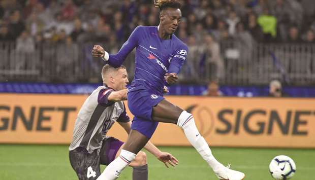 Chelseau2019s Tammy Abraham and Perth Gloryu2019s Shane Lowry (left) vie for the  ball during the friendly match in Perth. (AFP)