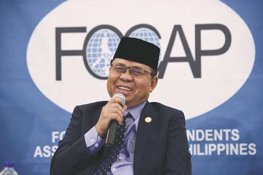 MILF chairman Murad Ebrahim speaks at a forum with the Foreign Correspondents Association in Manila yesterday after he was informed that the Bangsamoro Organic Law had been ratified in Congress.